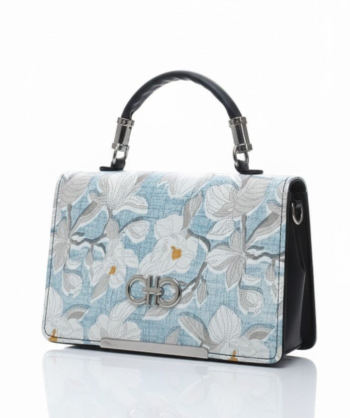 Close-up of blue floral jacquard bag with silver logo