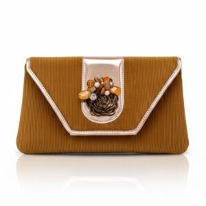 Front view of a mustard gold textured corduroy evening clutch with rose gold metallic trim and a central amber-toned floral embellishment.