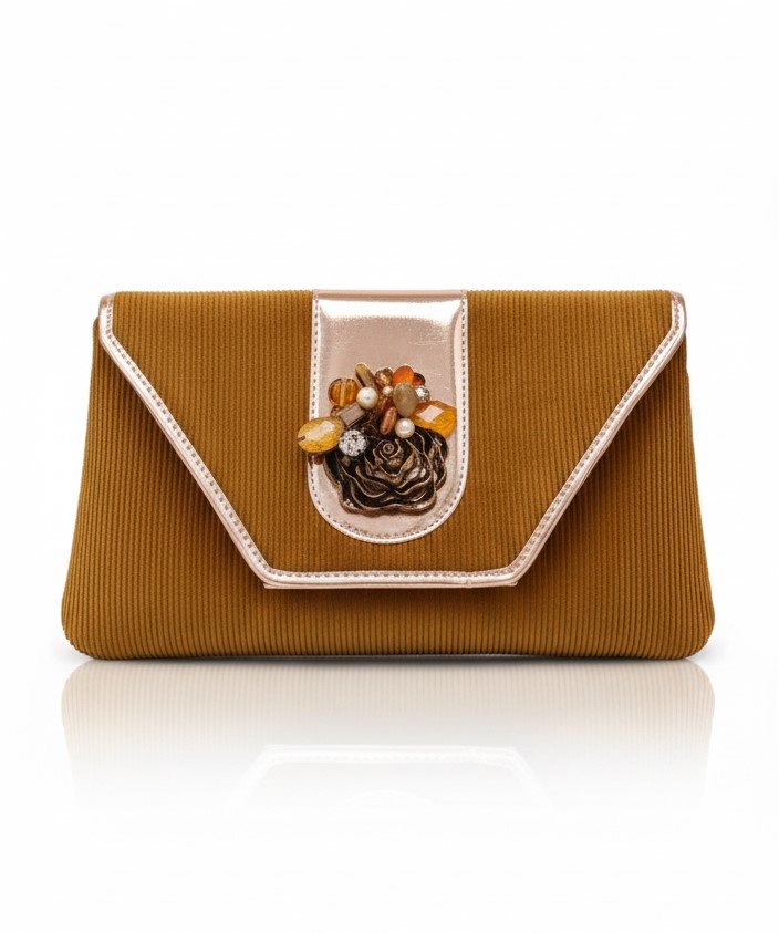 Front view of a mustard gold textured corduroy evening clutch with rose gold metallic trim and a central amber-toned floral embellishment.