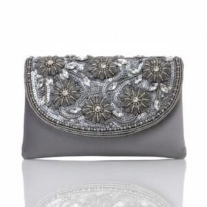 Front view of a slate gray satin clutch featuring intricate hand-beaded floral designs and silver sequins.